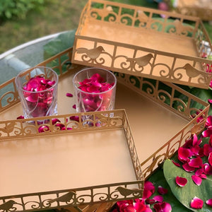 golden tray set with birds and scrolls