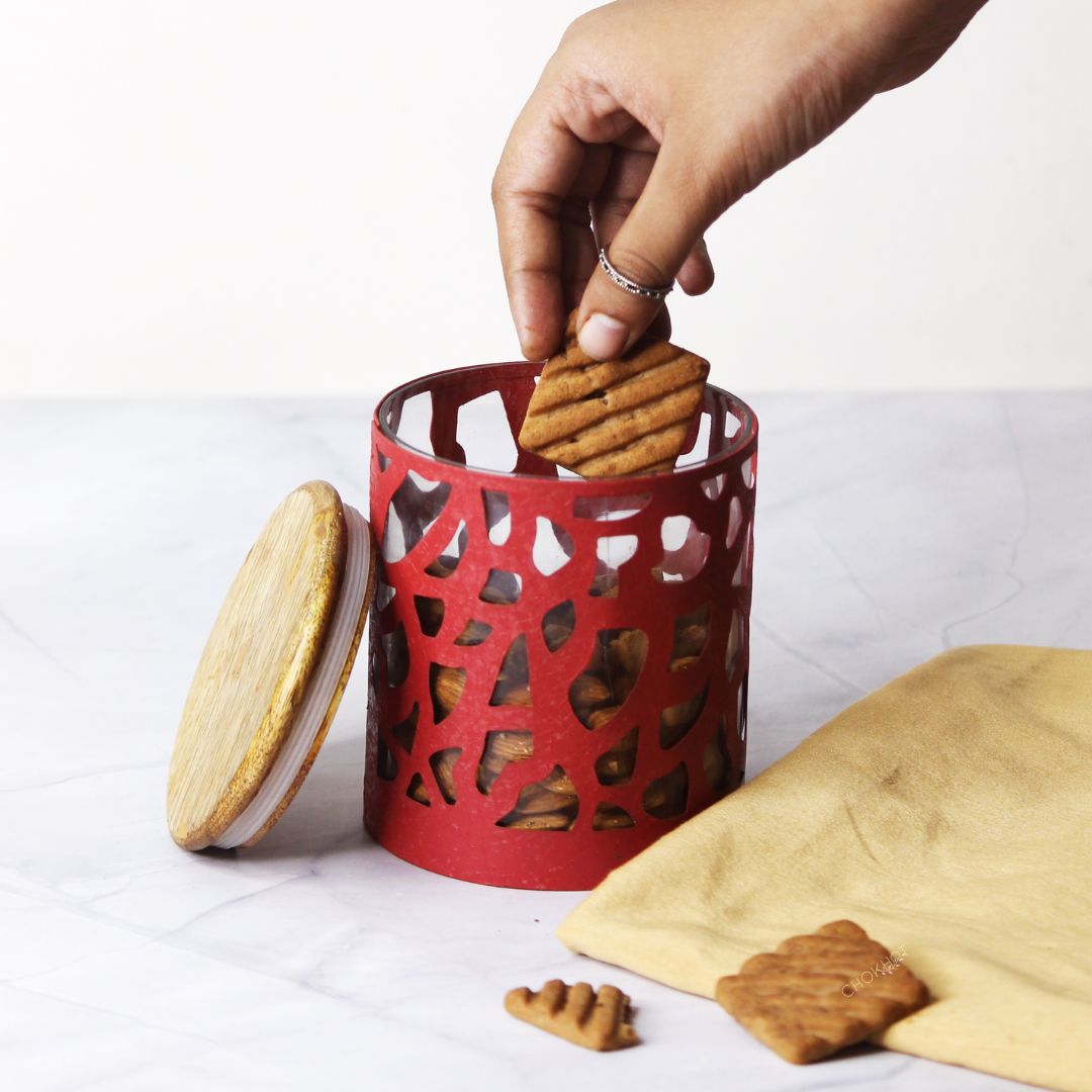 Red color metal giraffe shaped storage jar with wooden lid